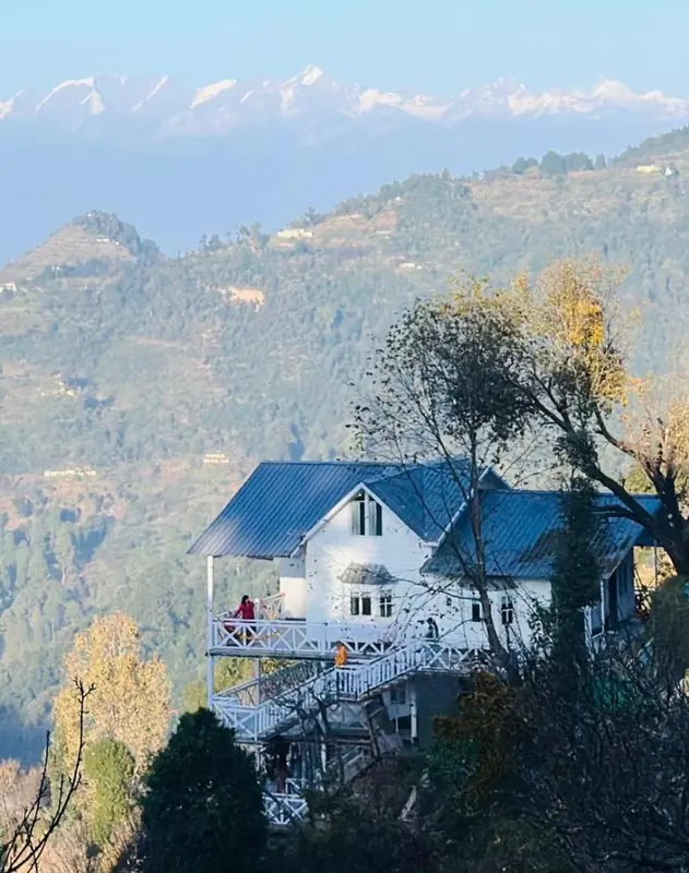 The cottage and the snow line at Namah Stay Himalayas, Kanatal