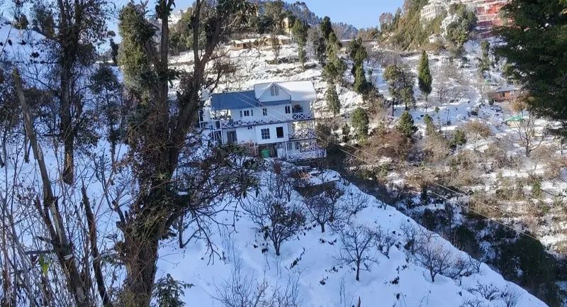The hillside in white at Namah Stay Himalayas, Kanatal
