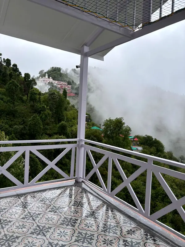 Mist at the railing at Namah Stay Himalayas, Kanatal